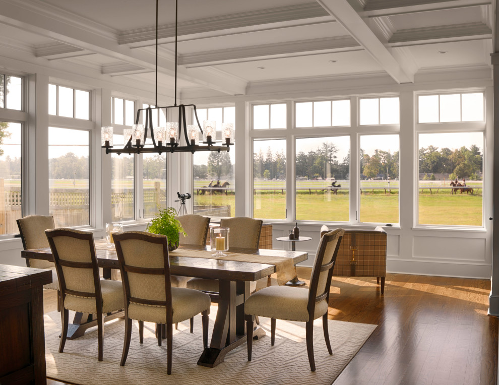 Inspiration for a large traditional kitchen/dining room with white walls, medium hardwood flooring, a coffered ceiling and panelled walls.