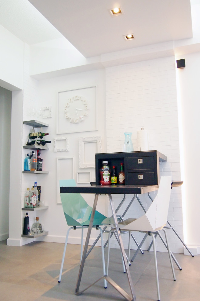 Dining room - contemporary dining room idea in Other with white walls