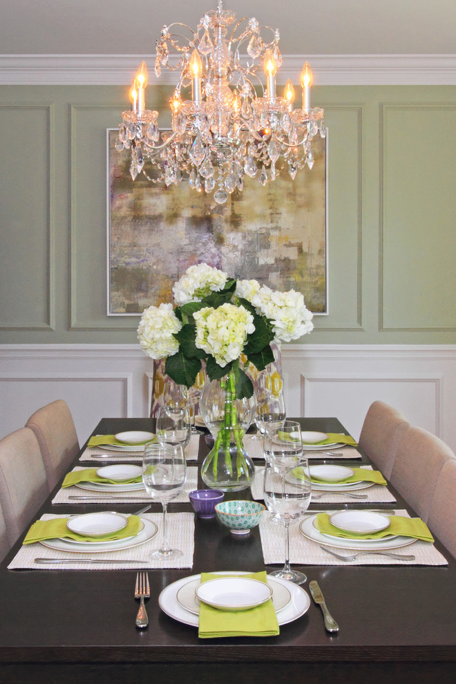 This is an example of a large traditional enclosed dining room in Boston with green walls and medium hardwood flooring.