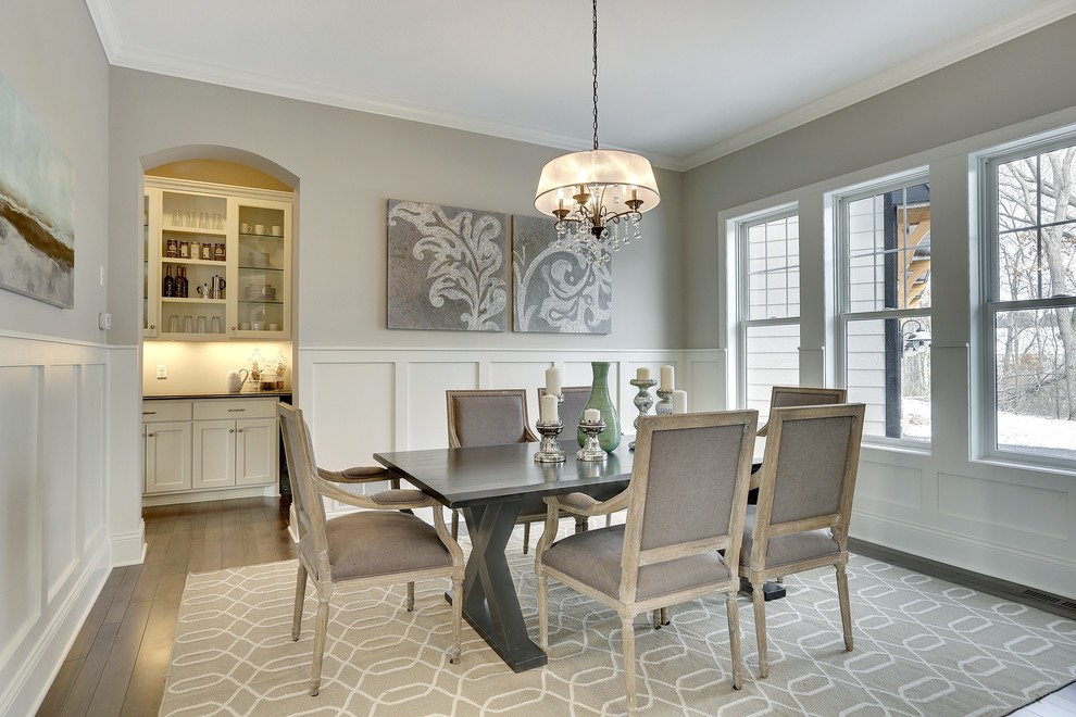 Large transitional dark wood floor enclosed dining room photo in Minneapolis with gray walls and no fireplace