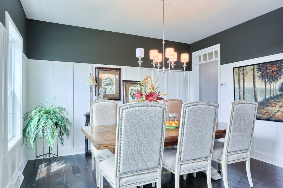 Mid-sized transitional dark wood floor enclosed dining room photo in Other with gray walls and no fireplace