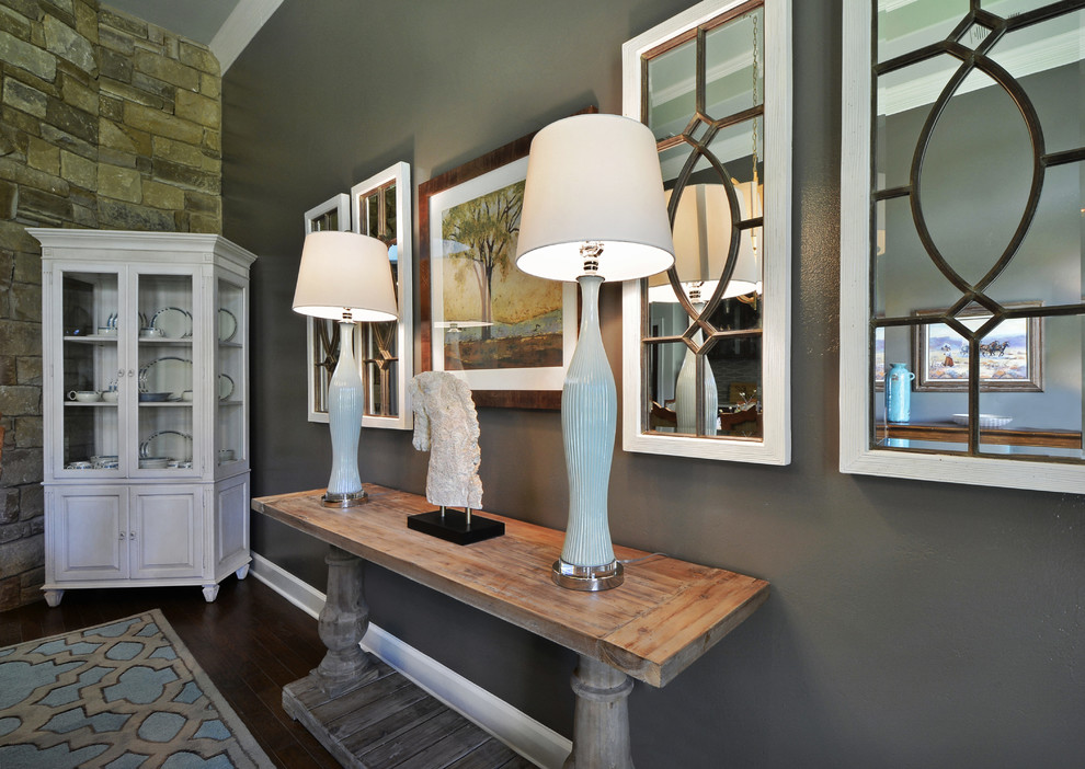 Inspiration for a medium sized traditional enclosed dining room in Austin with grey walls and dark hardwood flooring.