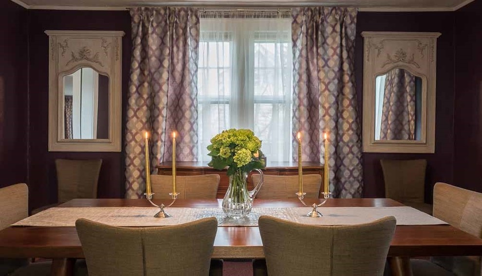 This is an example of a medium sized classic enclosed dining room in New York with purple walls and light hardwood flooring.