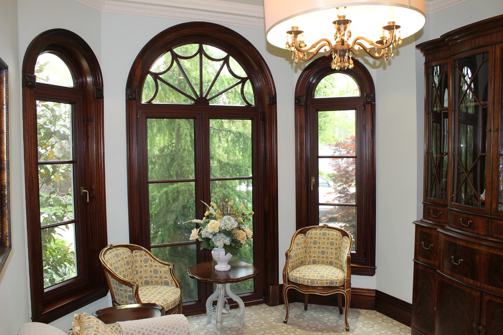 Example of a mid-sized ornate carpeted enclosed dining room design in New York with white walls
