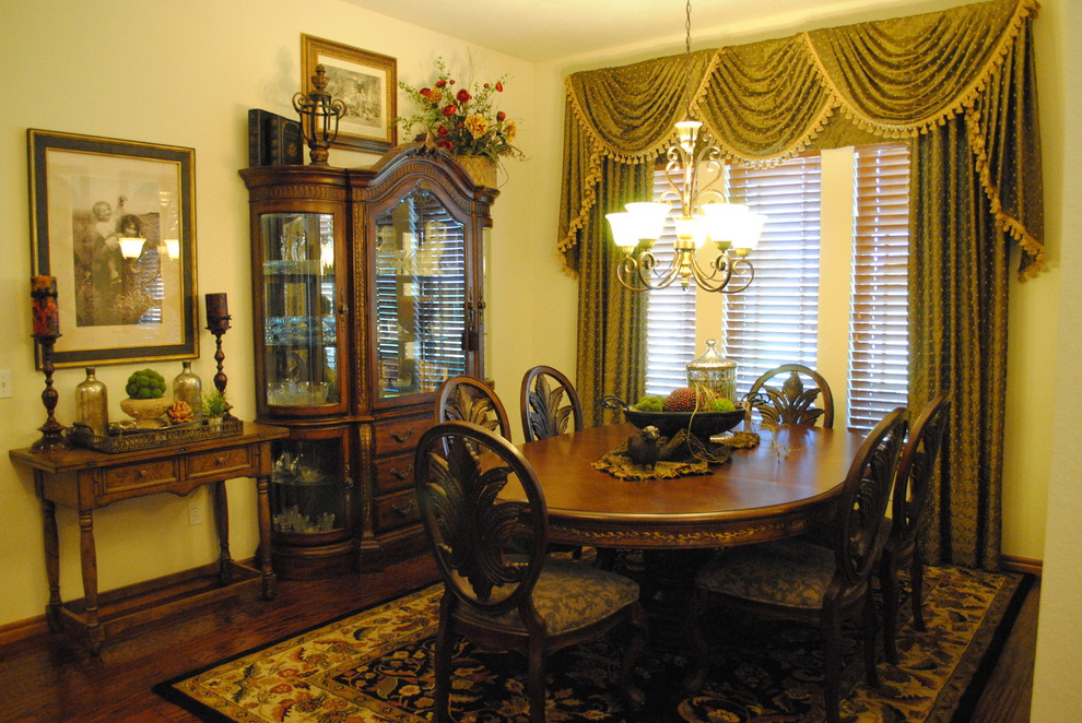 Photo of a medium sized traditional enclosed dining room in Oklahoma City with yellow walls, dark hardwood flooring, no fireplace and brown floors.