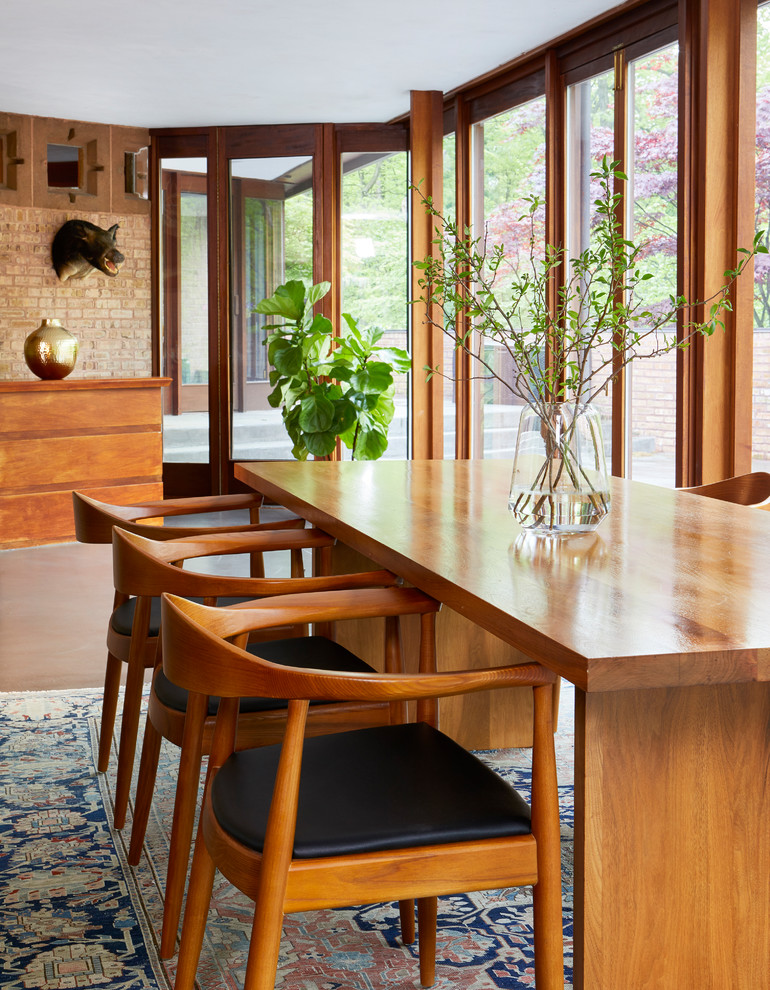 Kitchen/dining room combo - large 1950s concrete floor kitchen/dining room combo idea in Chicago