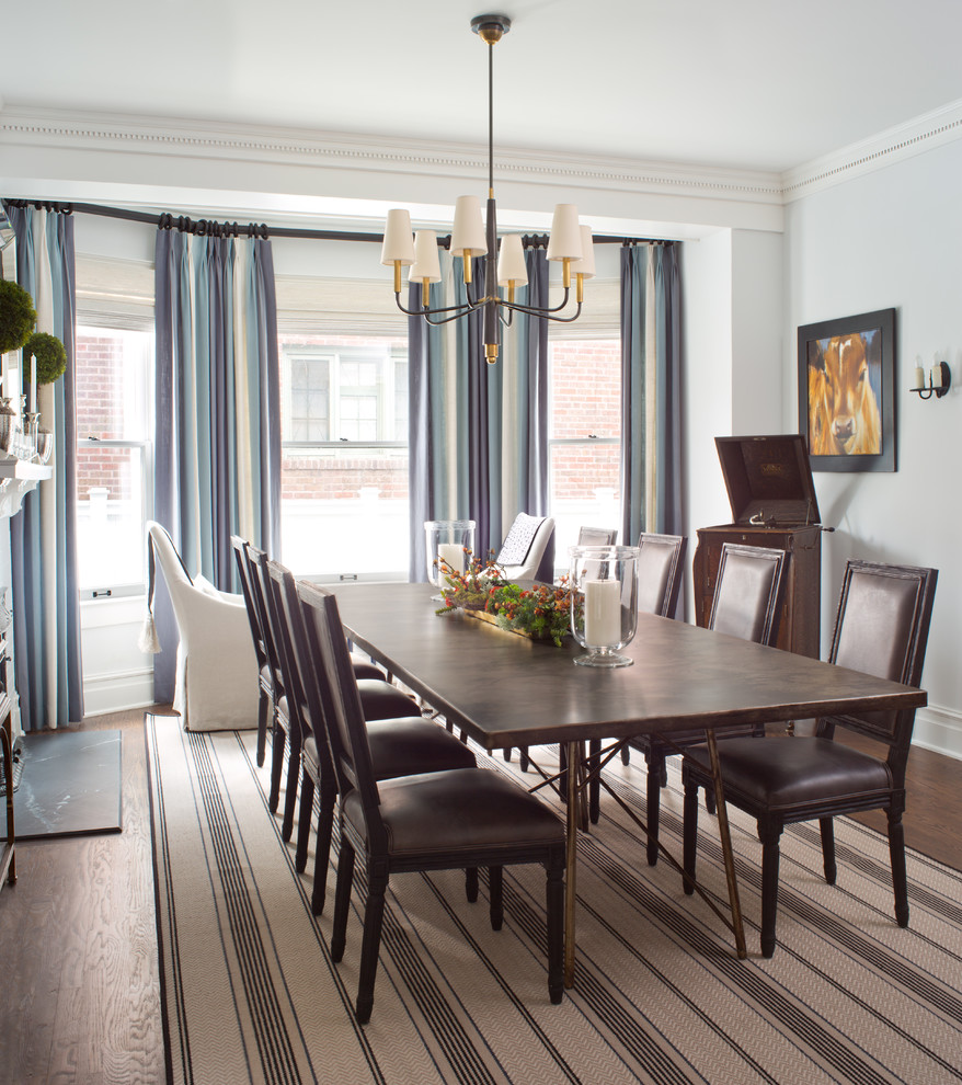 Medium sized classic enclosed dining room in Denver with blue walls, dark hardwood flooring and brown floors.