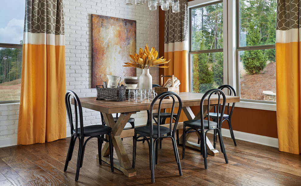 Example of a classic dining room design in Charlotte