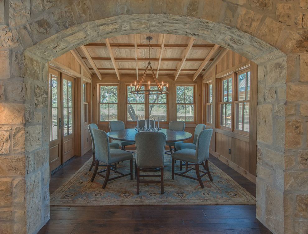 Enclosed dining room - large rustic dark wood floor enclosed dining room idea in Austin with no fireplace