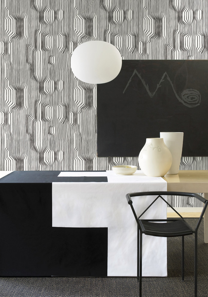 Esempio di una sala da pranzo minimalista con pareti multicolore e moquette