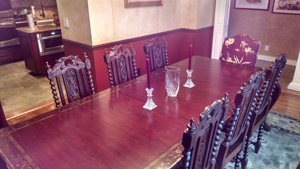 Inspiration for a medium sized traditional dining room in New York with red walls and medium hardwood flooring.