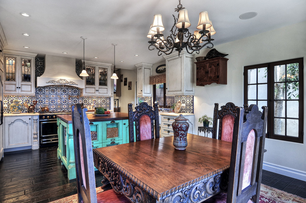 Medium sized mediterranean kitchen/dining room in Orange County with grey walls, dark hardwood flooring and no fireplace.