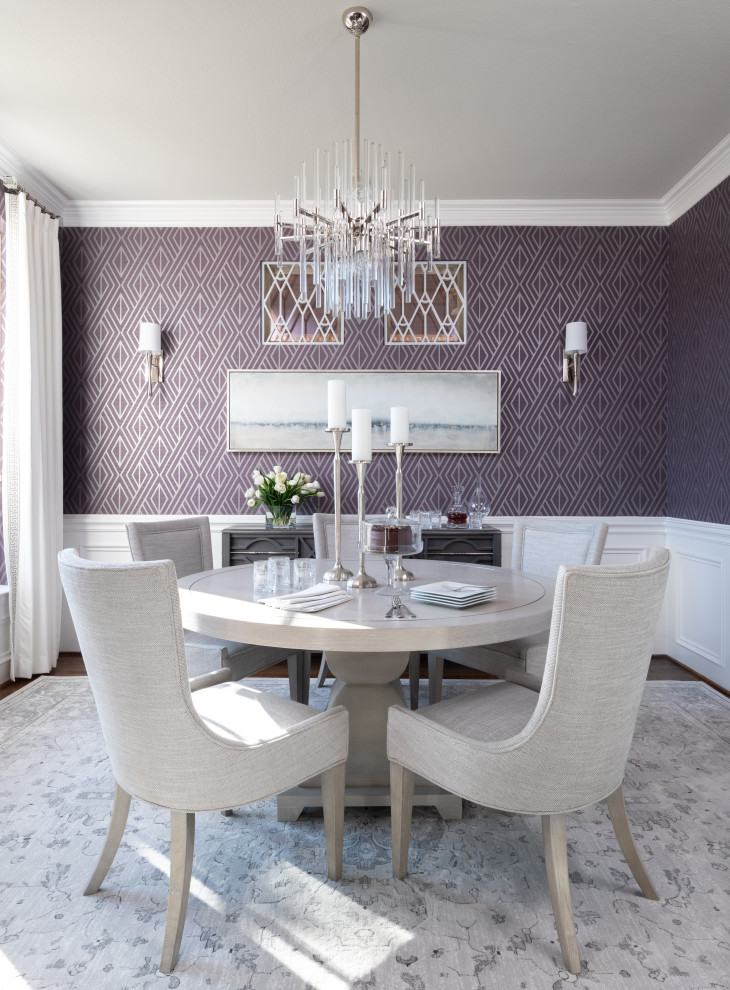 Mid-sized elegant medium tone wood floor, brown floor and wallpaper enclosed dining room photo in Dallas with purple walls