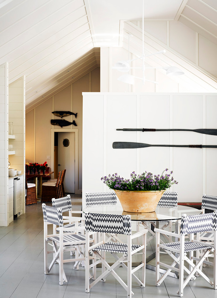 Inspiration for a coastal painted wood floor and gray floor dining room remodel in Boston with white walls