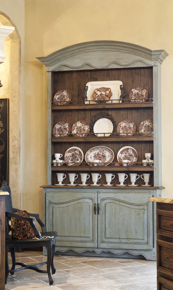 Inspiration for a rustic dining room remodel in Oklahoma City with beige walls