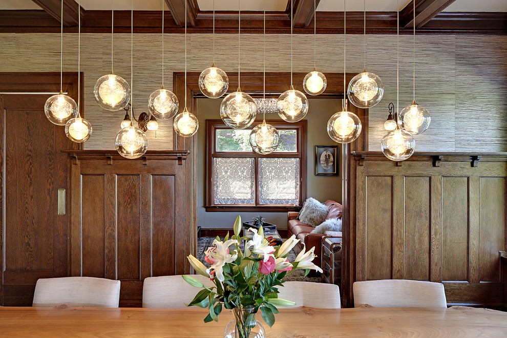 Example of an arts and crafts dining room design in Seattle