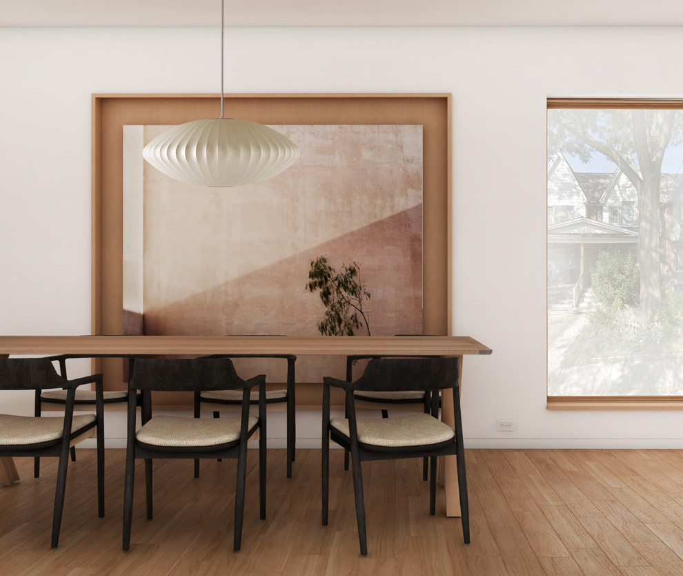 Inspiration for a modern light wood floor dining room remodel with white walls