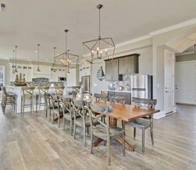 Kitchen/dining room combo - large coastal vinyl floor and brown floor kitchen/dining room combo idea in Other with gray walls