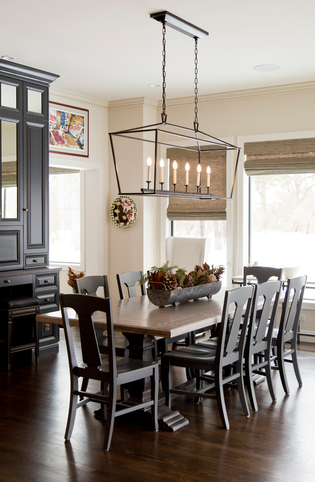 Example of a mid-sized transitional dark wood floor and brown floor kitchen/dining room combo design in St Louis with beige walls