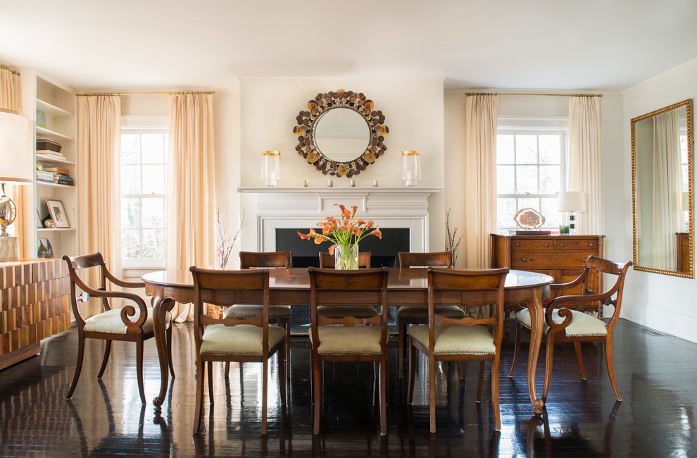 Large transitional dark wood floor dining room photo in New York with white walls, a standard fireplace and a metal fireplace