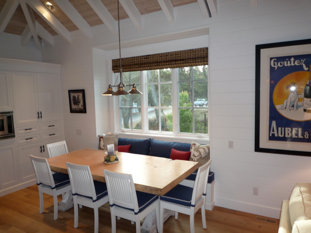 Mid-sized transitional light wood floor kitchen/dining room combo photo in Portland with white walls and no fireplace