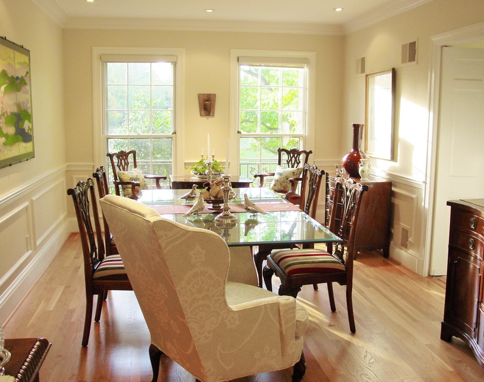 Photo of a medium sized bohemian enclosed dining room in DC Metro with white walls, light hardwood flooring, no fireplace and beige floors.
