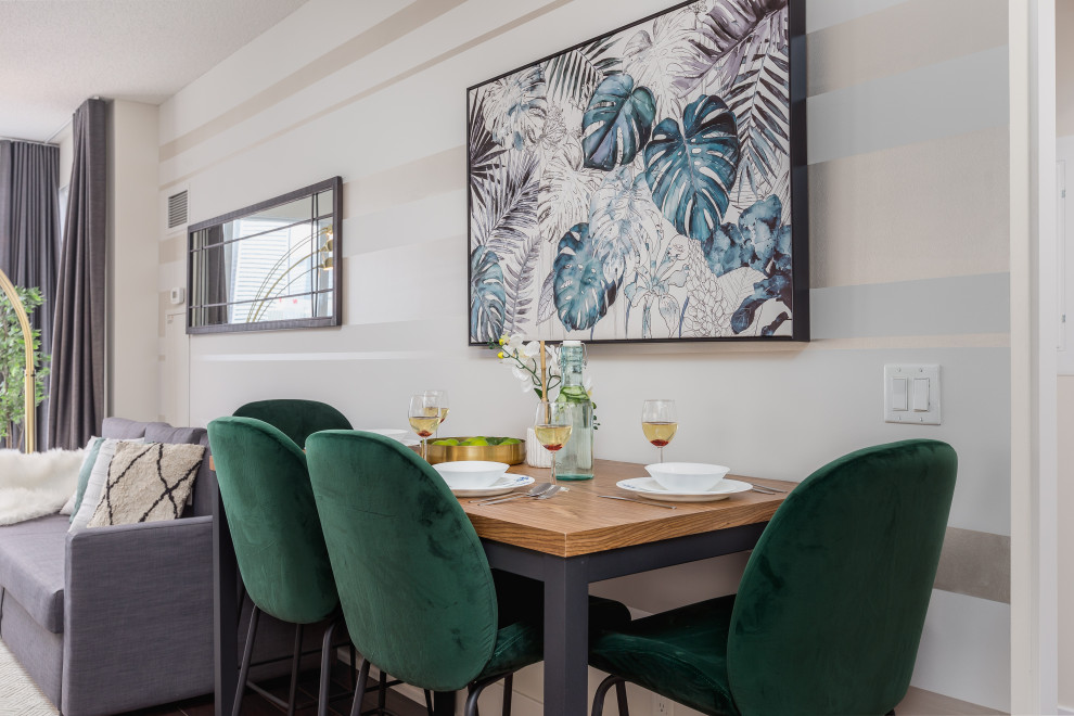 Example of a mid-sized trendy wallpaper dining room design in Toronto with multicolored walls