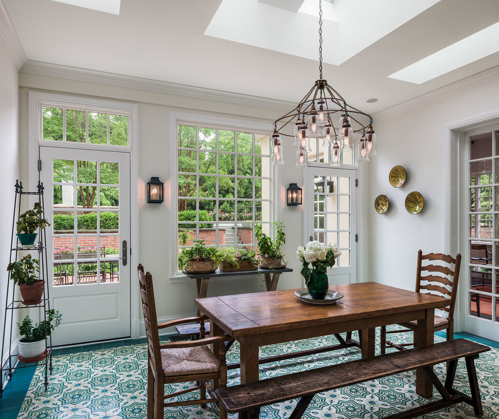 Example of a classic multicolored floor enclosed dining room design in Philadelphia with white walls and no fireplace