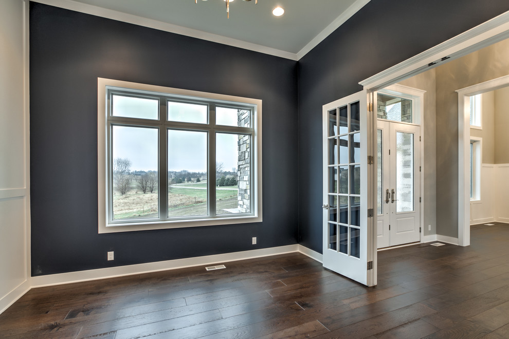 Great room - large farmhouse dark wood floor and brown floor great room idea in Omaha with blue walls and no fireplace
