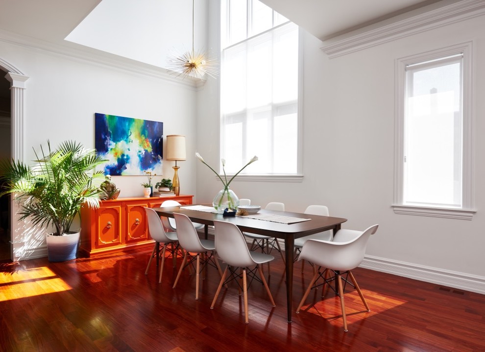 Great room - eclectic medium tone wood floor and red floor great room idea in Chicago with white walls