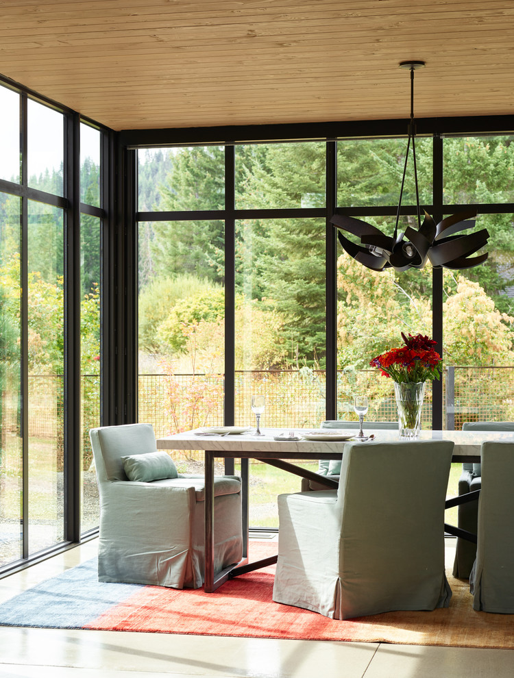 Design ideas for a contemporary dining room in Seattle with concrete flooring and grey floors.