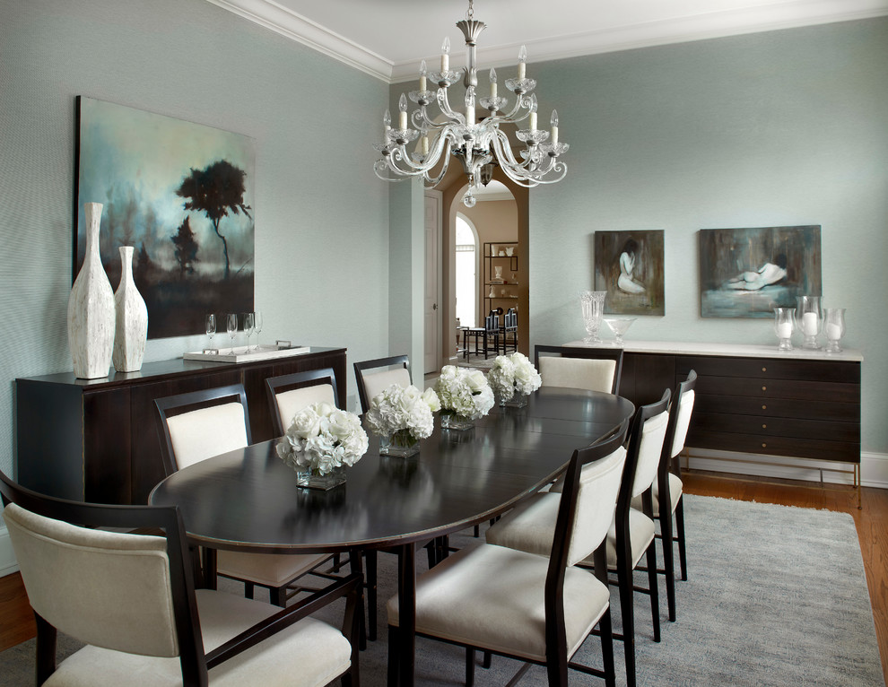 This is an example of a medium sized traditional enclosed dining room in Chicago with grey walls and medium hardwood flooring.