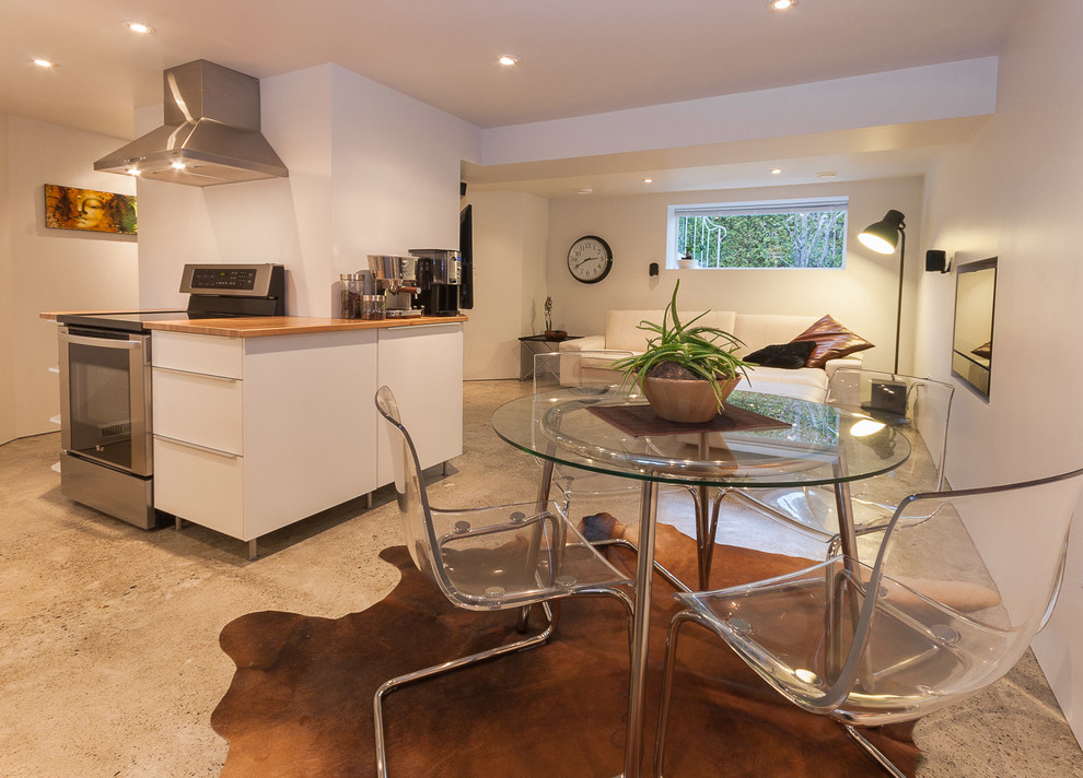 Example of a trendy great room design in Vancouver with white walls