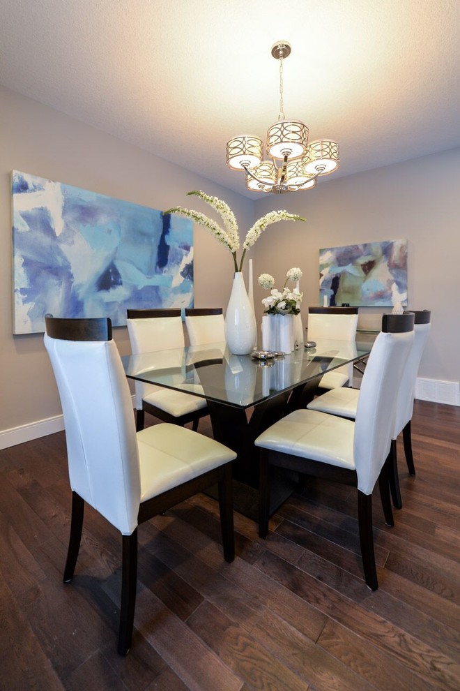 Inspiration for a medium sized contemporary enclosed dining room in Calgary with beige walls, dark hardwood flooring, no fireplace and brown floors.