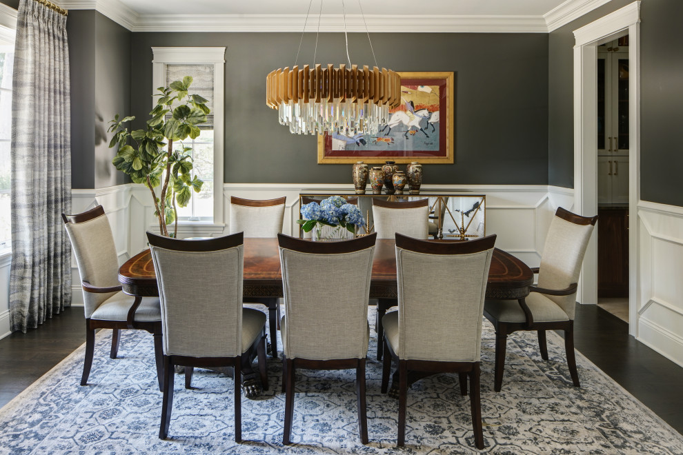 Inspiration for a large timeless dark wood floor and brown floor enclosed dining room remodel in Chicago with gray walls
