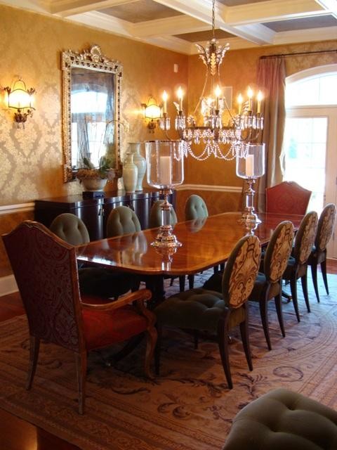 Example of a large classic medium tone wood floor enclosed dining room design in Other