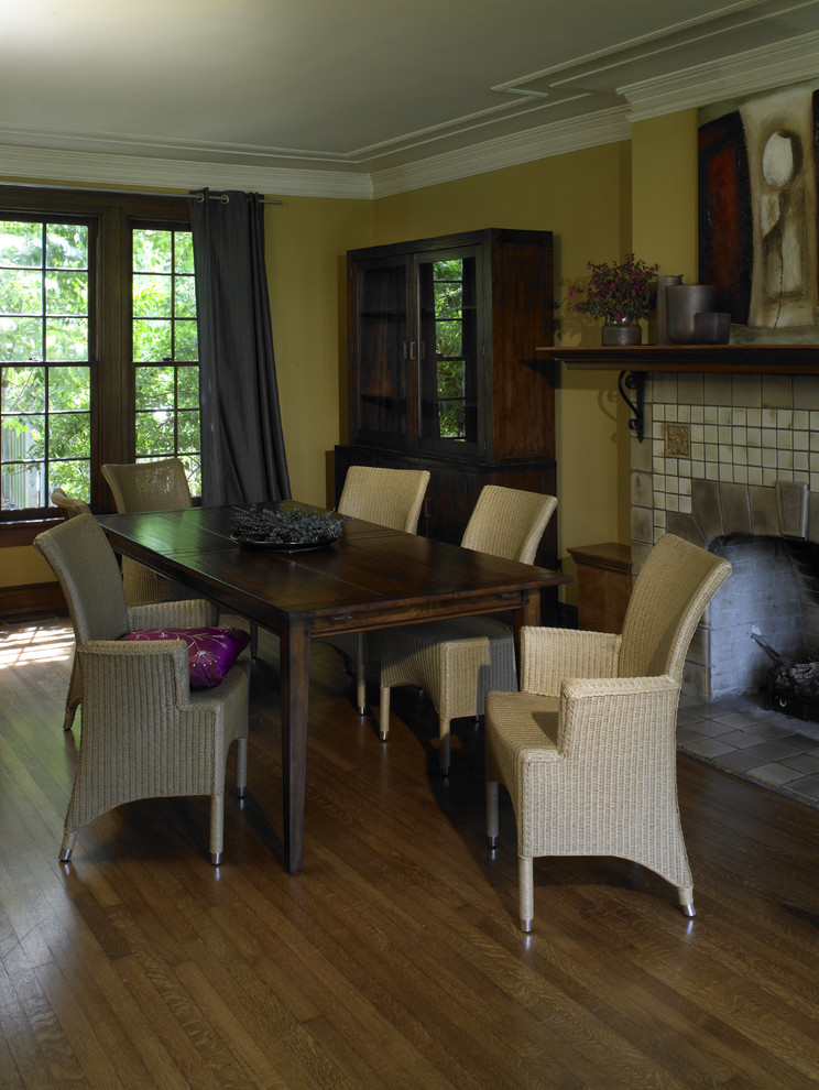 Example of a mountain style dining room design in Atlanta with a tile fireplace