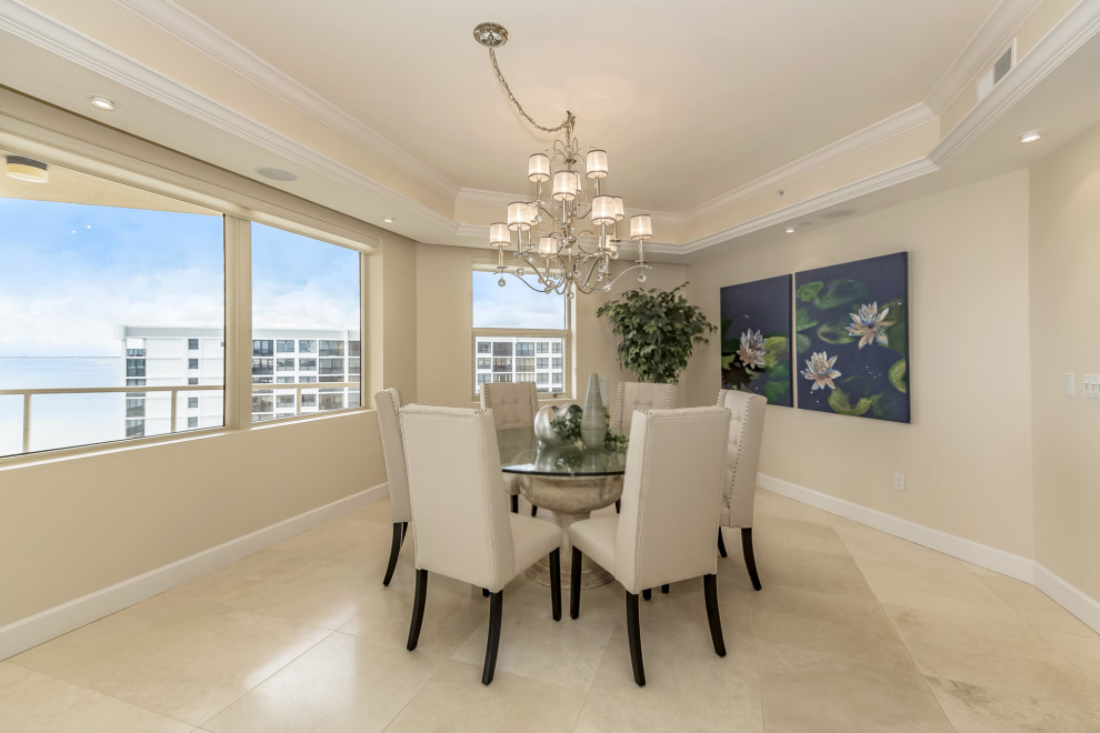 Inspiration for a large contemporary open plan dining room in Tampa with beige walls, travertine flooring and beige floors.