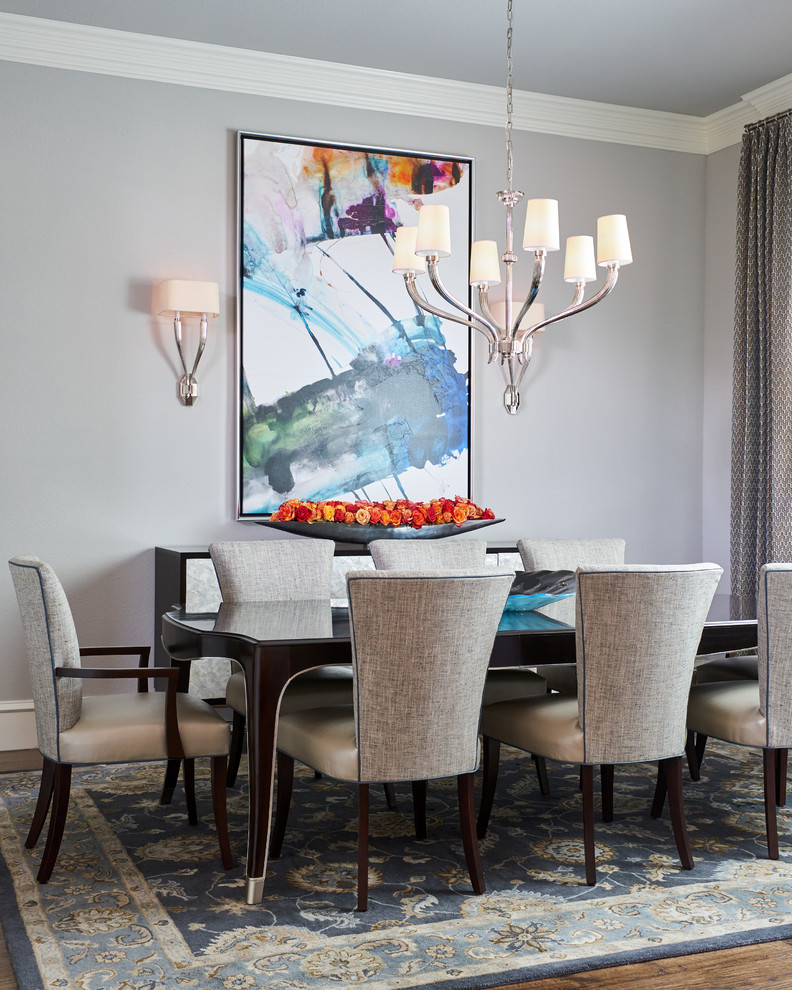 Example of a large classic dining room design in Other with gray walls
