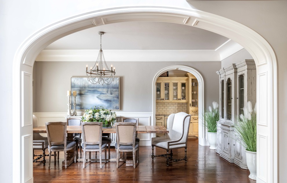 Photo of an enclosed dining room in Sacramento with grey walls, no fireplace, dark hardwood flooring and brown floors.