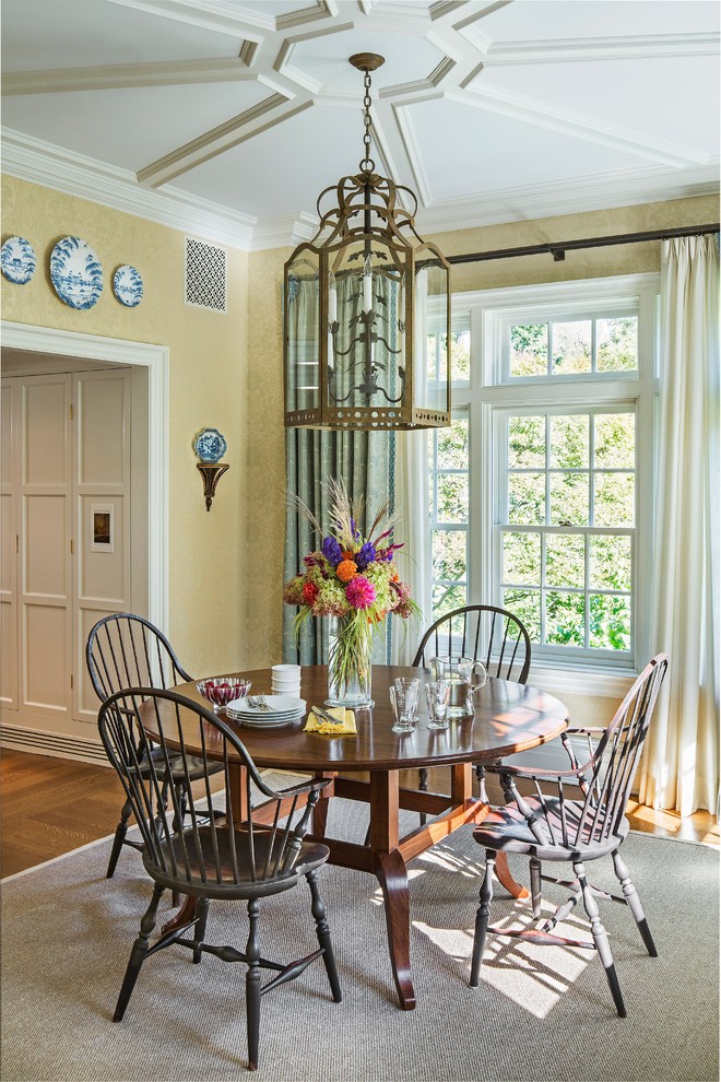 This is an example of an expansive traditional dining room in New York with medium hardwood flooring and brown floors.