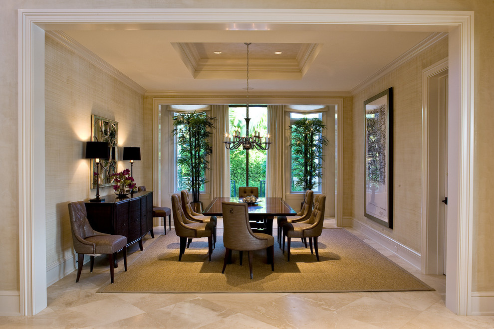 Dining room - large transitional travertine floor dining room idea in Miami with beige walls
