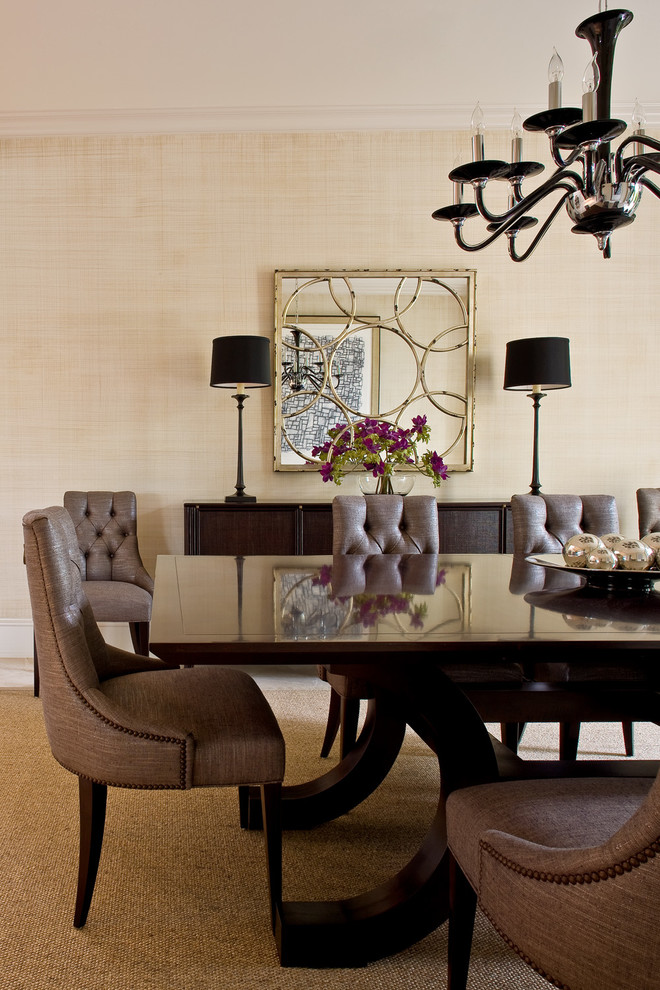 Photo of a large traditional dining room in Miami with beige walls and carpet.