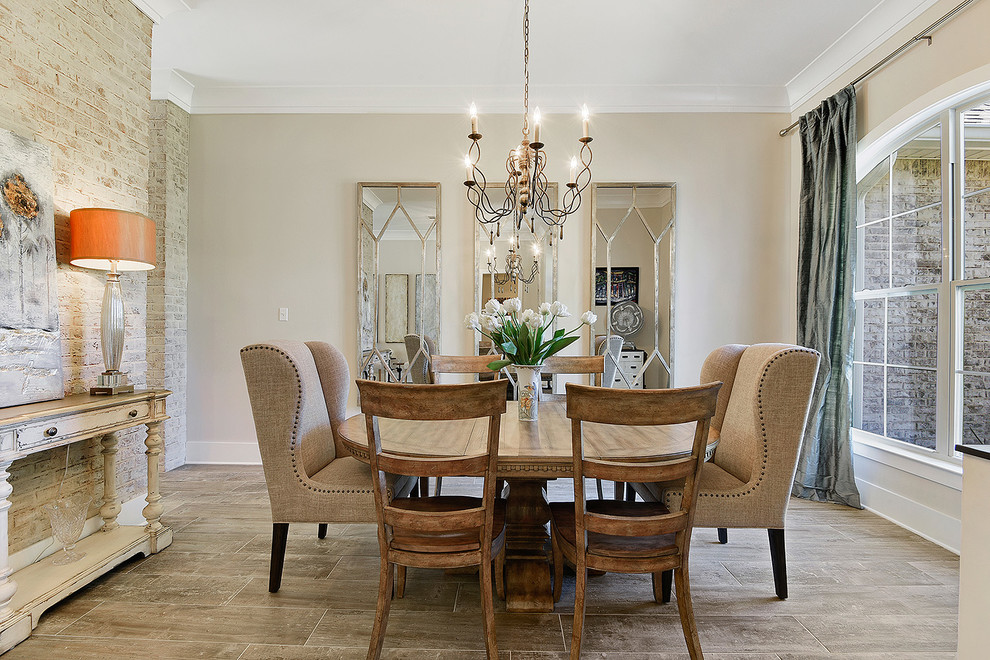 Small traditional open plan dining room in New Orleans with beige walls, no fireplace, brown floors and porcelain flooring.