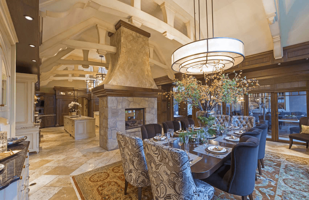 This is an example of an expansive classic enclosed dining room in Calgary with beige walls, ceramic flooring, a two-sided fireplace, a stone fireplace surround and beige floors.