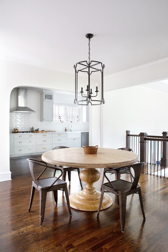 Elegant dark wood floor and brown floor kitchen/dining room combo photo in Atlanta with white walls