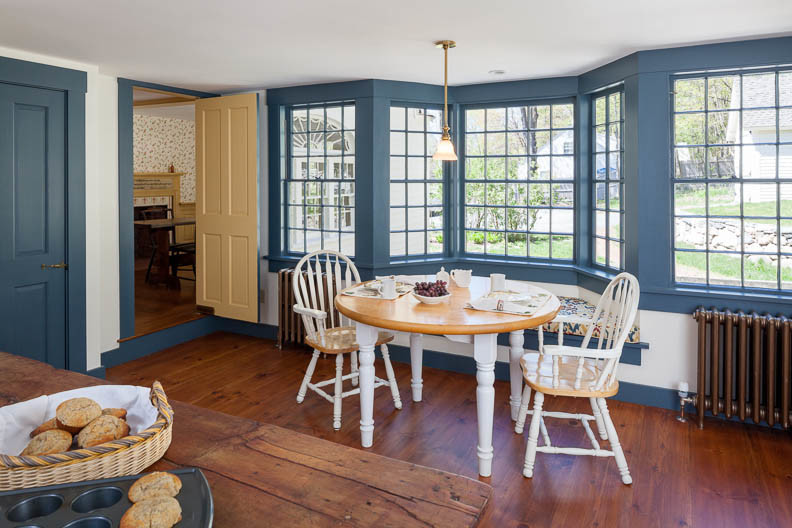 Example of a farmhouse kitchen/dining room combo design in Boston