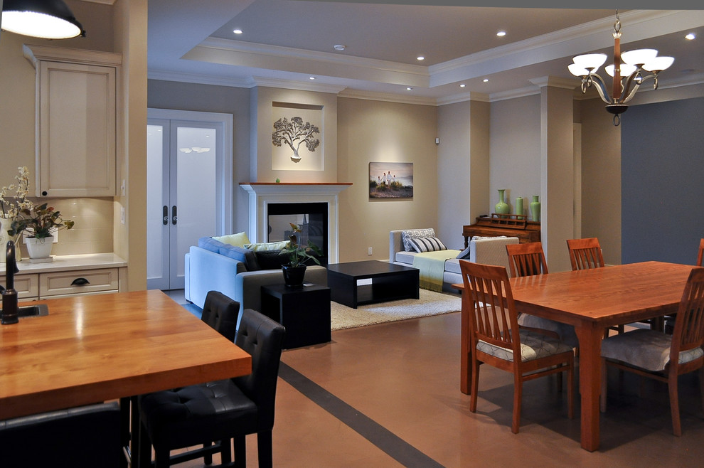 Réalisation d'une salle à manger ouverte sur la cuisine design de taille moyenne avec un mur beige, sol en stratifié et une cheminée standard.