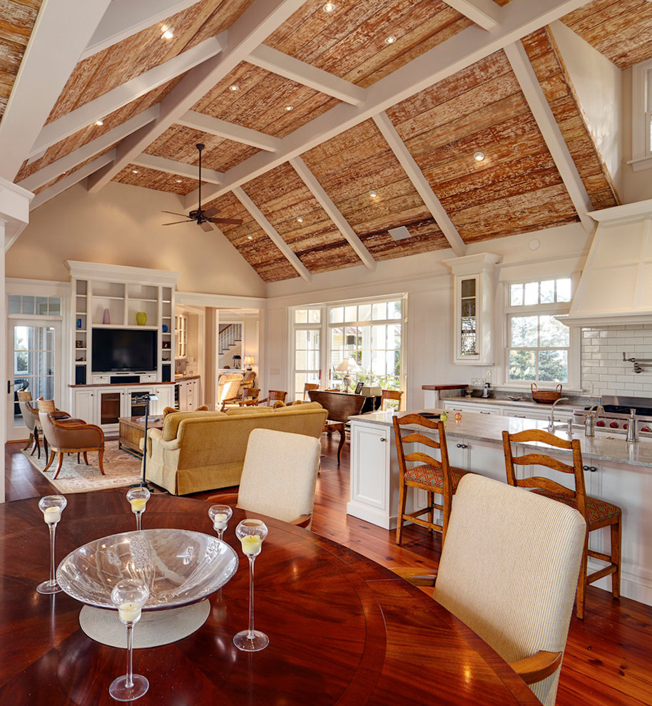 Example of a large trendy medium tone wood floor kitchen/dining room combo design in Charleston with white walls and no fireplace