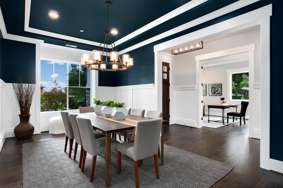 Design ideas for a large traditional enclosed dining room in Seattle with blue walls, dark hardwood flooring and brown floors.